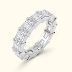 Elegant silver ring featuring a series of emerald-cut diamonds arranged in a band.