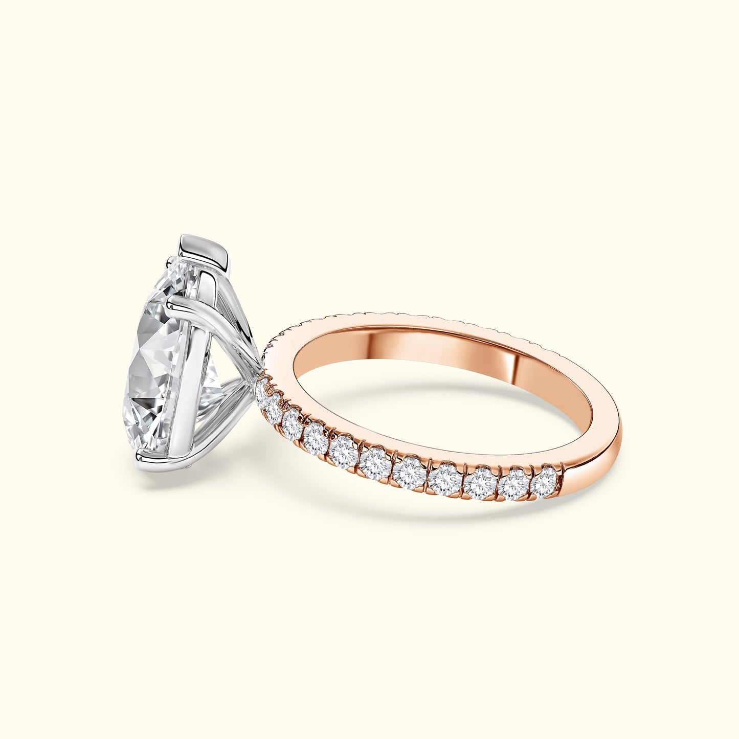 Rose gold and silver engagement ring with a large diamond and smaller diamonds on the band.