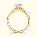Elegant yellow gold engagement ring featuring a prominent square diamond.