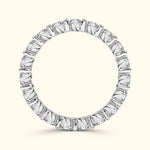 A circular silver ring adorned with multiple evenly spaced diamonds.