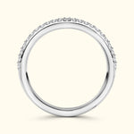 Elegant silver band ring adorned with small sparkling diamonds along the top edge.