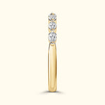 Elegant gold ring featuring three sparkling diamonds set in a row.