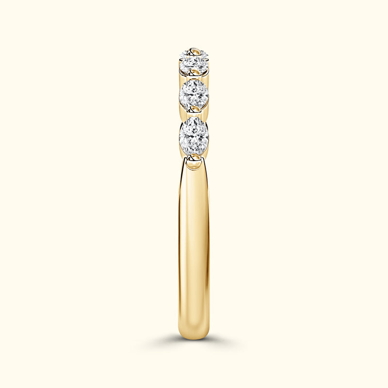 Elegant gold ring featuring three sparkling diamonds set in a row.