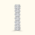 Elegant diamond band with alternating round and oval diamonds set in a smooth prong setting.
