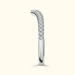 Elegant silver ring adorned with sparkling diamonds along the top.