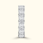 Clear emerald-cut diamond band with alternating stone sizes, elegantly arranged in a vertical line.