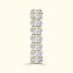 Gold band ring adorned with evenly spaced, sparkling round diamonds.