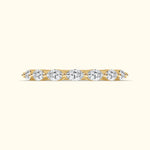 Yellow gold band with alternating round diamonds set in a row.