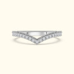 Silver chevron ring adorned with sparkling diamonds.