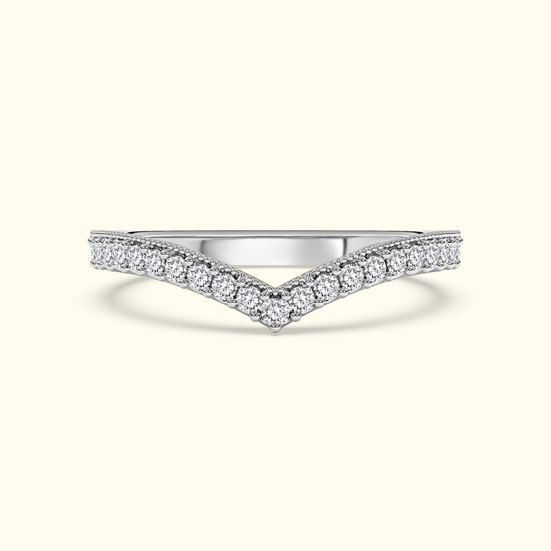 Silver chevron ring adorned with sparkling diamonds.