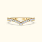 Elegant gold ring with a V-shape design, adorned with sparkling diamonds.