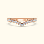 V-shaped rose gold ring adorned with sparkling diamonds along the band.