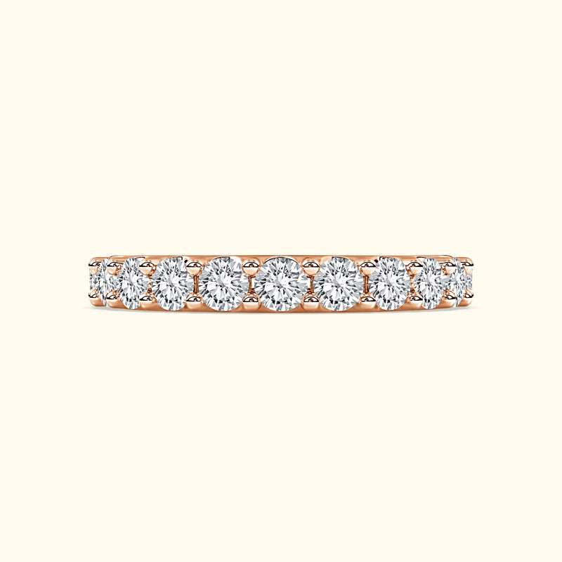 Rose gold band featuring a row of sparkling round diamonds.