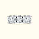 White gold band featuring five oval-cut diamonds in a row.