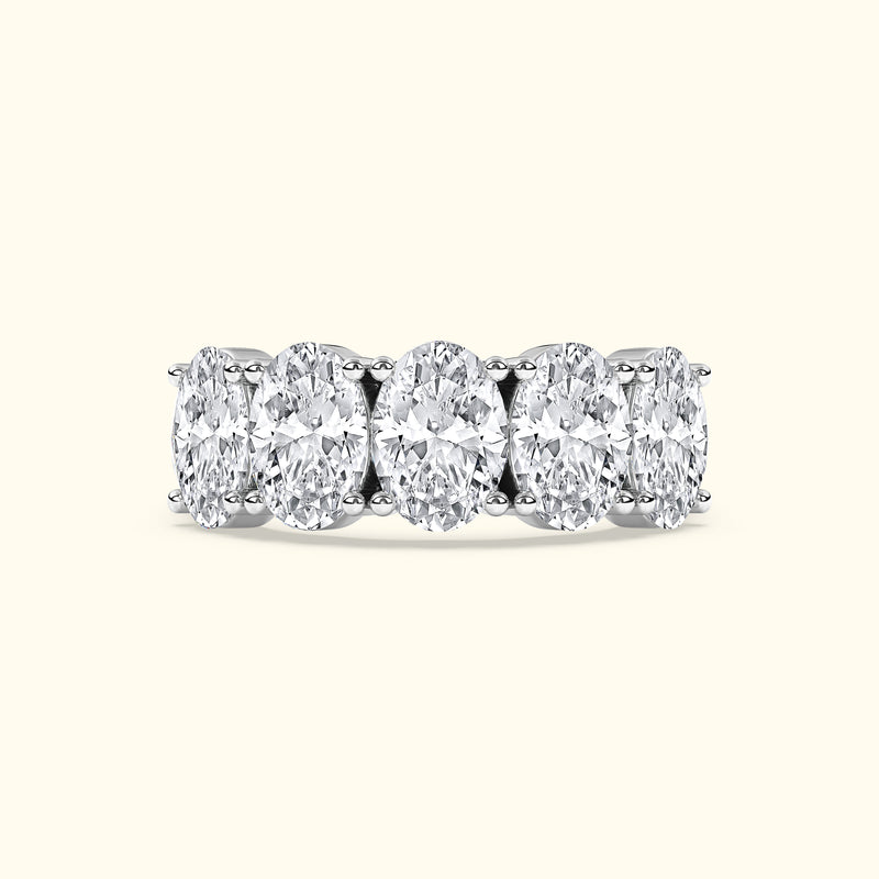 White gold band featuring five oval-cut diamonds in a row.