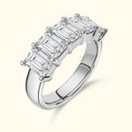 Elegant silver ring featuring five rectangular diamonds in a row.