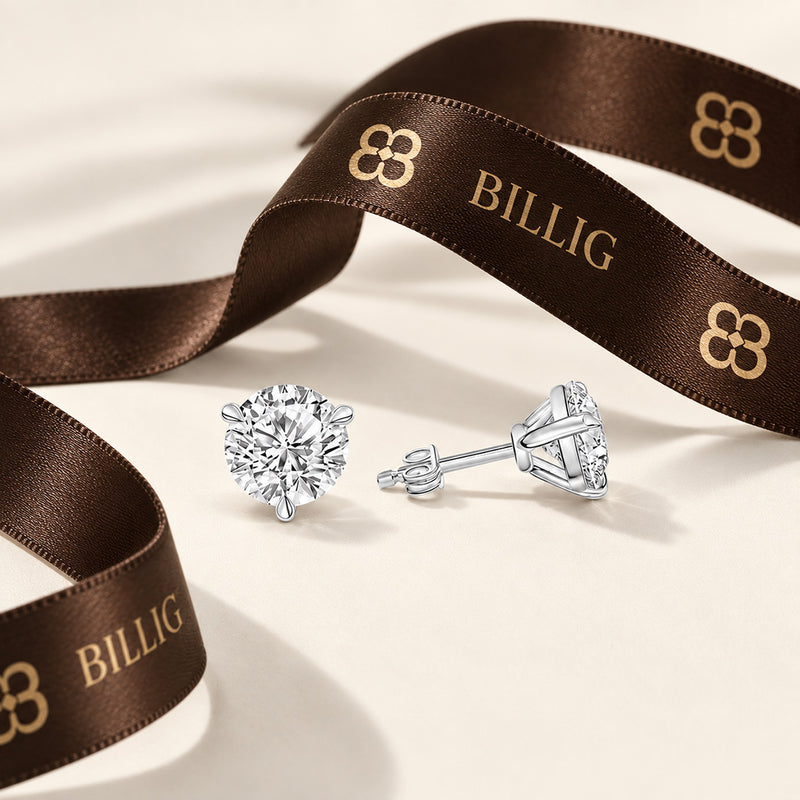 4.00 CTW round lab-grown diamond stud earrings in a signature three-prong martini-style 14kt white gold setting.