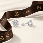 2.00 CTW round lab-grown diamond stud earrings in a signature three-prong martini-style 14kt white gold setting.