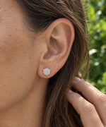 4.00 CTW round lab-grown diamond stud earrings in a signature three-prong martini-style 14kt white gold setting.