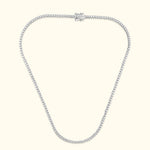 Elegant silver chain necklace adorned with sparkling gemstones, featuring a secure clasp.