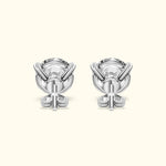 Elegant silver earrings with a unique design featuring a central gemstone.