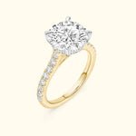 Sparkling diamond engagement ring with a gold band and side diamonds.