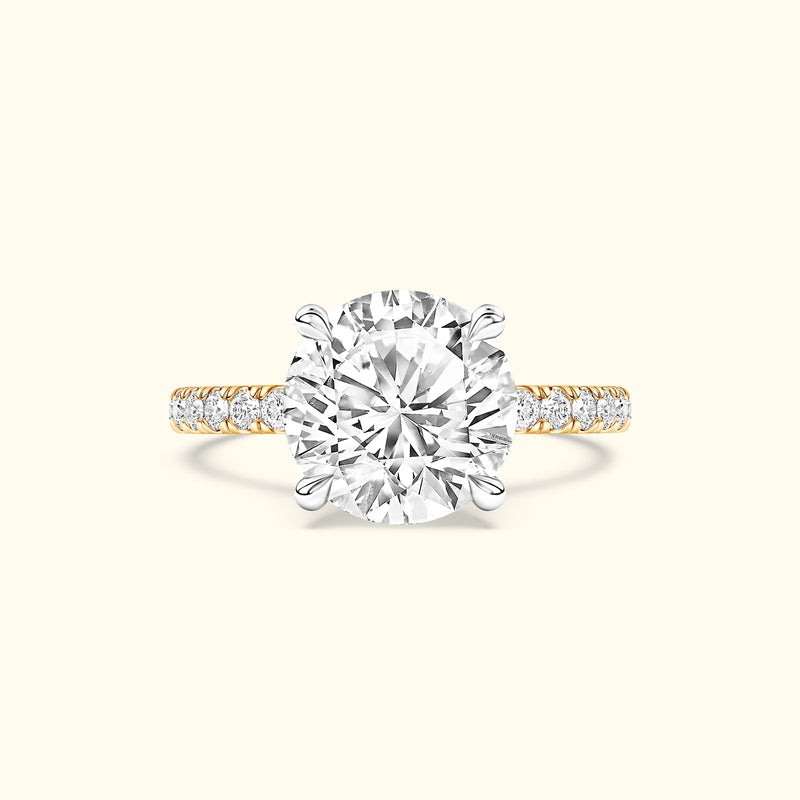 Elegant engagement ring with a large center diamond and a diamond-accented band.