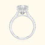A solitaire diamond ring with a sparkling halo, set in a white gold band.