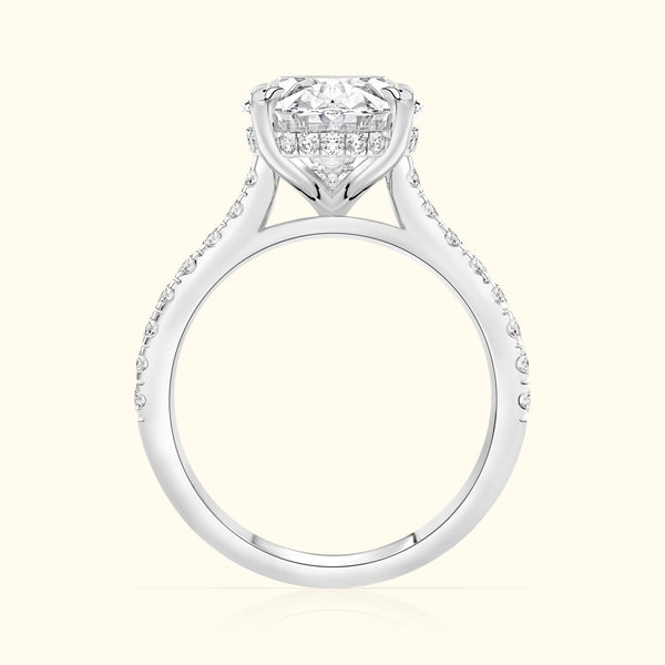A solitaire diamond ring with a sparkling halo, set in a white gold band.