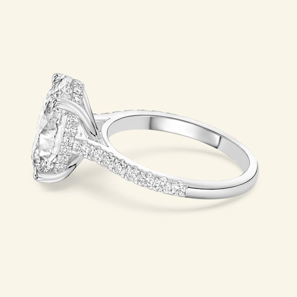 Elegant silver ring featuring a large diamond centerpiece and smaller accent diamonds.