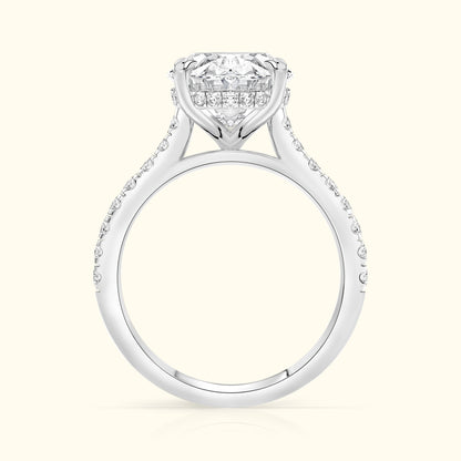 Elegant diamond engagement ring with a central stone and pave-set diamonds along the band.