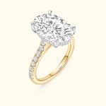 Elegant yellow gold ring featuring a large round diamond centerpiece and smaller side diamonds.