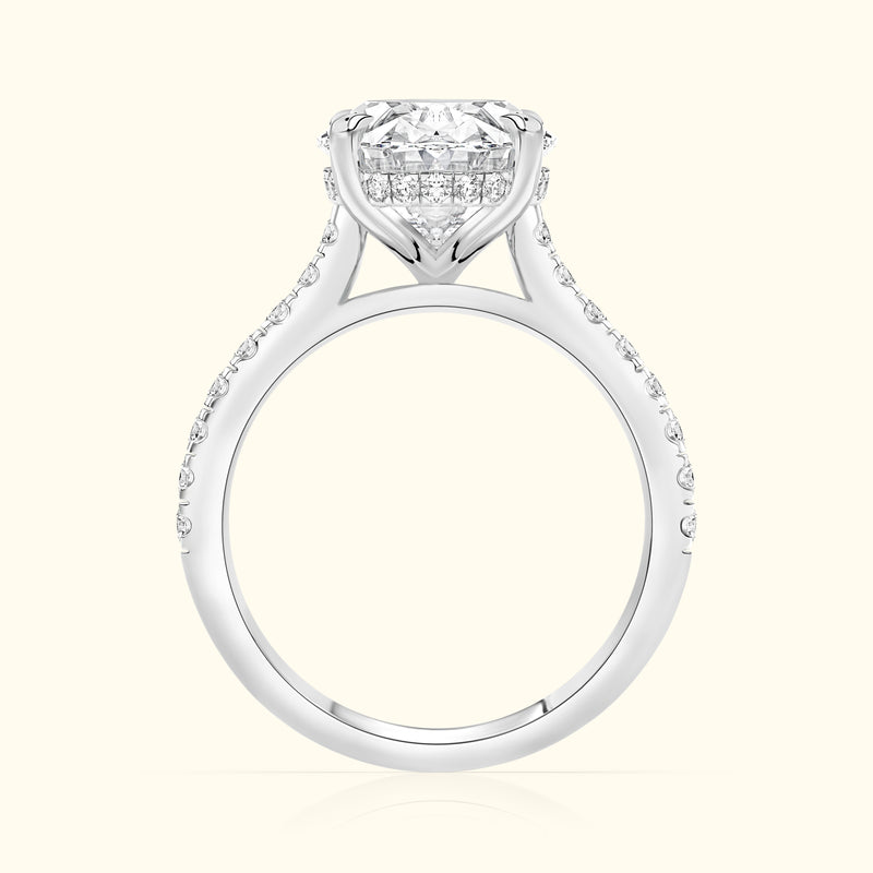 Elegant diamond engagement ring with a halo setting and sparkling side stones.