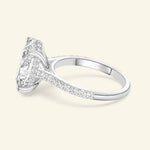 Sparkling diamond engagement ring with a square cut center stone and delicate band.