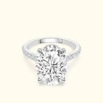 Elegant oval diamond engagement ring with a sparkling pavé band.