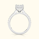 Elegant diamond engagement ring featuring a central cluster and side stones set in white gold.