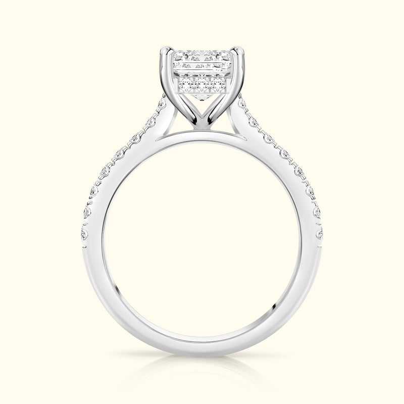Elegant diamond engagement ring featuring a central cluster and side stones set in white gold.