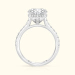 Elegant white gold engagement ring with a large diamond and smaller accent stones.