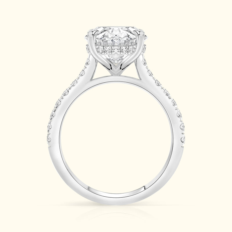Elegant white gold engagement ring with a large diamond and smaller accent stones.