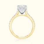 Solitaire diamond engagement ring with a yellow gold band and white gold setting.