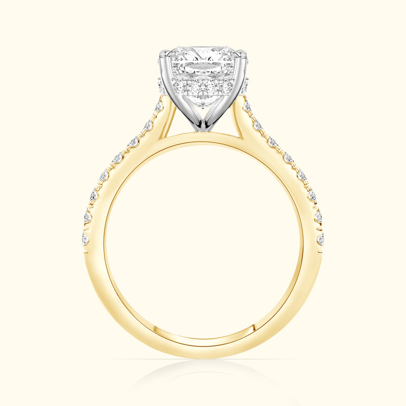 Solitaire diamond engagement ring with a yellow gold band and white gold setting.