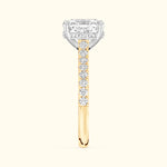 Elegant ring featuring a large rectangular diamond and smaller diamonds on a gold band.