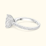 Elegant silver ring featuring a large rectangular diamond and smaller accent stones.