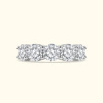 Diamond band ring with five round-cut stones set in a sleek white gold setting.
