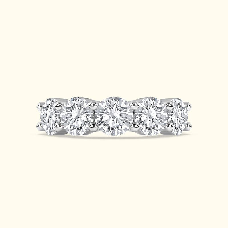 Diamond band ring with five round-cut stones set in a sleek white gold setting.