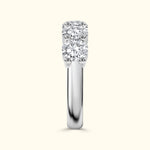 Three-stone diamond ring with a polished white gold band.