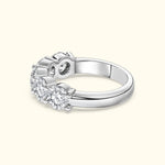 Three-stone diamond ring with a polished white gold band.