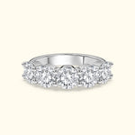 Elegant diamond band featuring five round brilliant stones set in white gold.