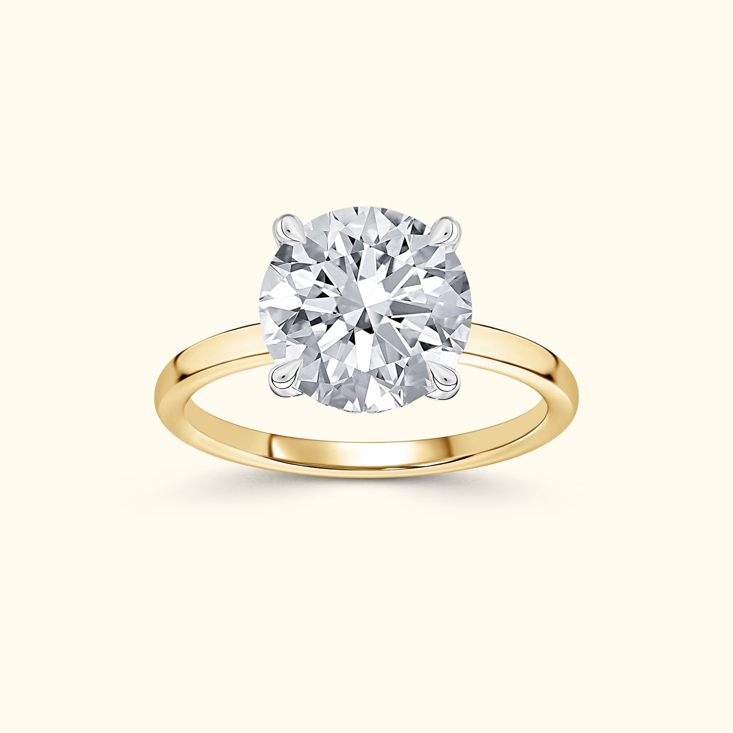 Elegant yellow gold ring featuring a large round diamond in a four-prong setting.