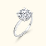 Solitaire diamond ring with a round cut stone set in a polished silver band.